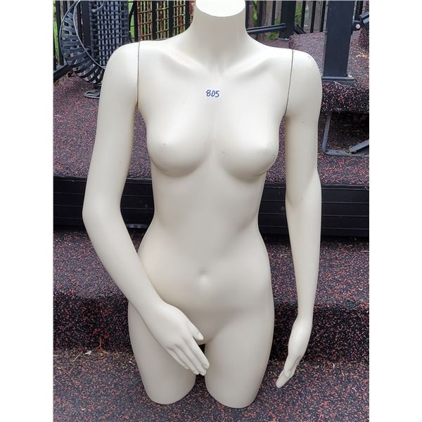 Thigh length mannequin with removable arms.