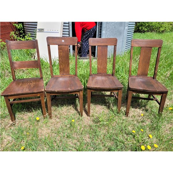 4 vintage solid oak chairs. 3 + 1 style patterns. Need minor repair.