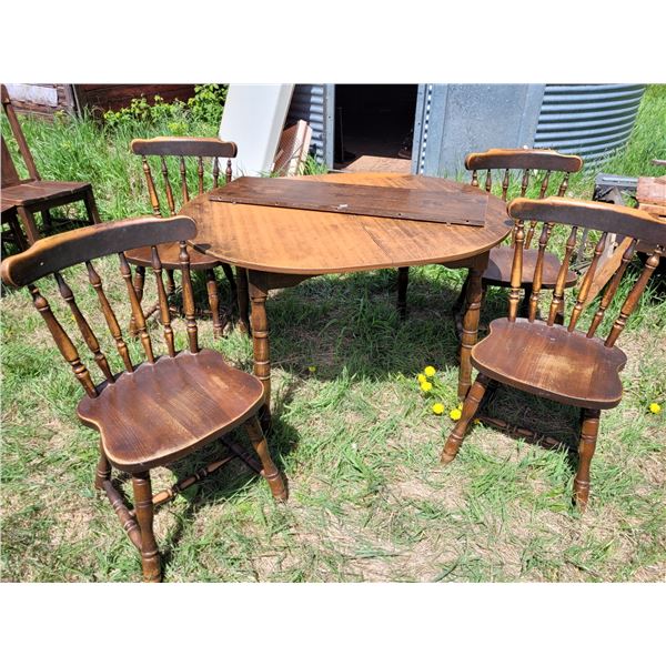 Wood table, leaf & 4 chairs. Table top is quite worn.