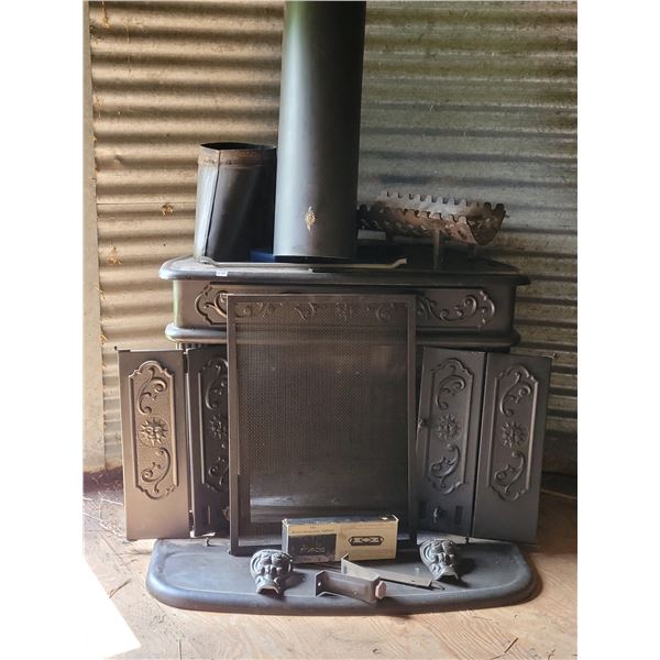 Complete Cast iron wood stove/ fireplace. Ornate, & in excellent condition