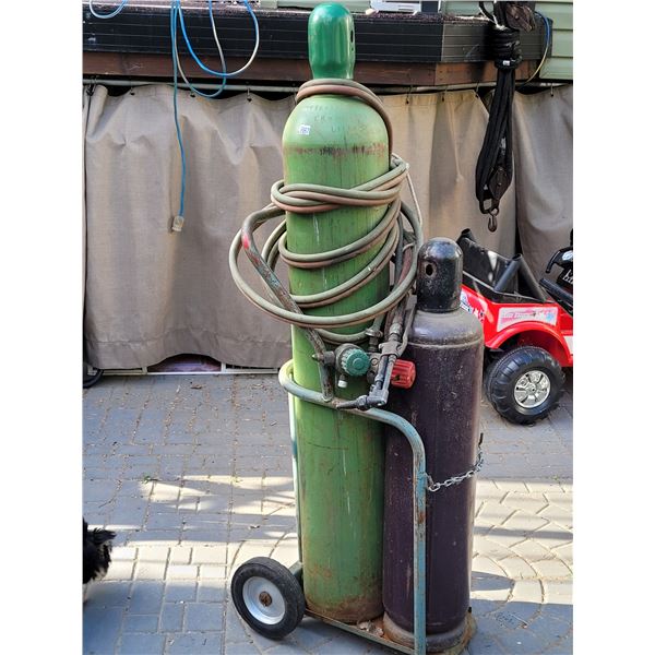 Oxygen & acetylene tanks, hose & torch. Not used for some time. Condition unknown.