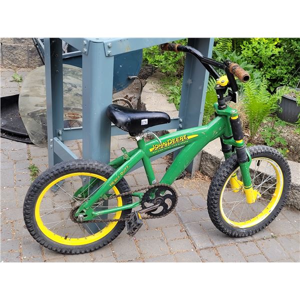 Small John Deere Bicycle. Adjustable seat spring forks. Back tire needs repair.