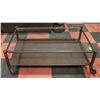 METAL/GLASS COFFEE TABLE ON CASTORS 47" X 29" X 18