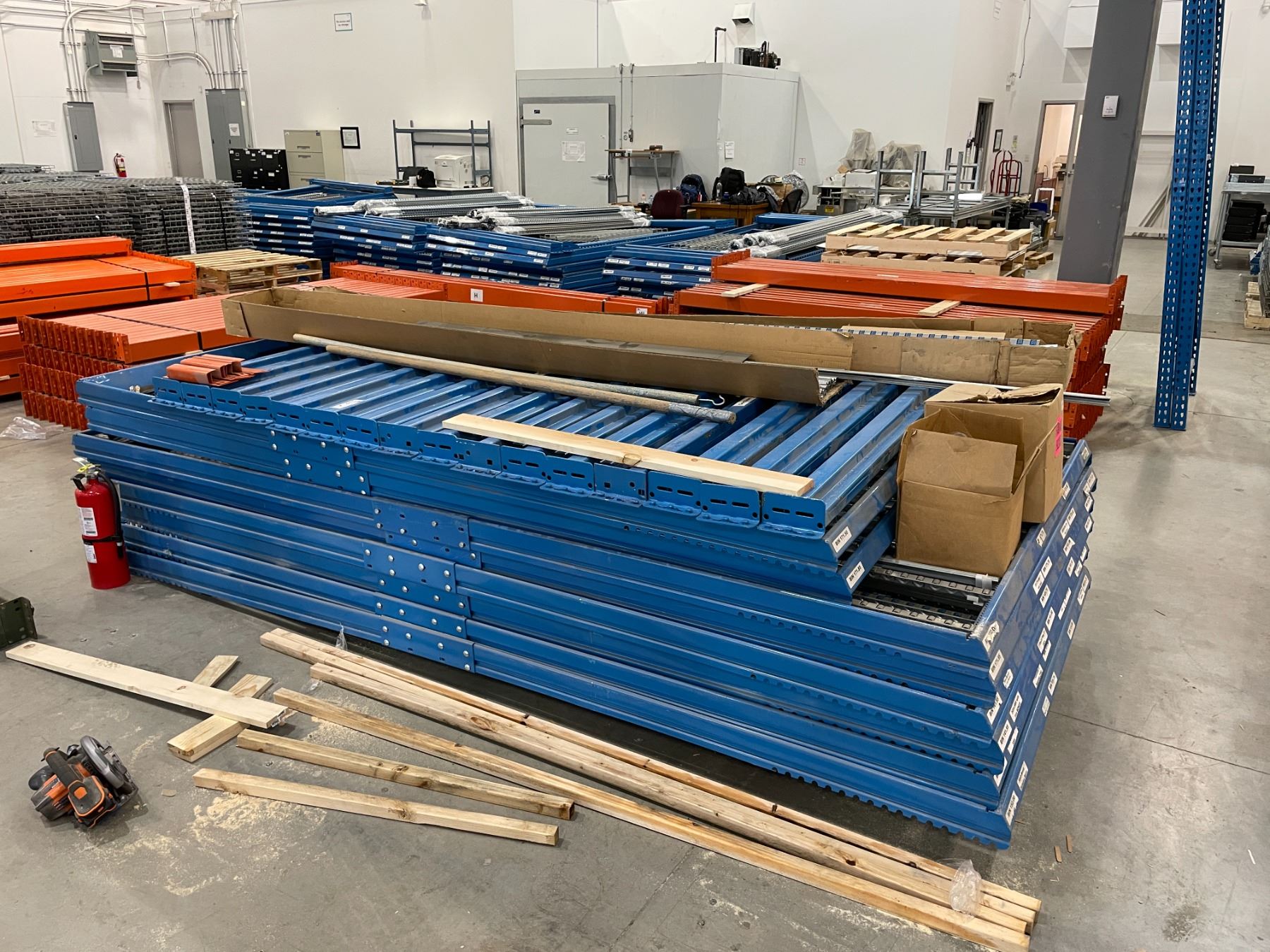 Feeder Racking STACK OF BLUE TEARDROP GRAVITY ROLLER FEEDER RACKING SYSTEM PARTS