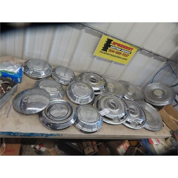 14 Chevy hubcaps + 1 Nash