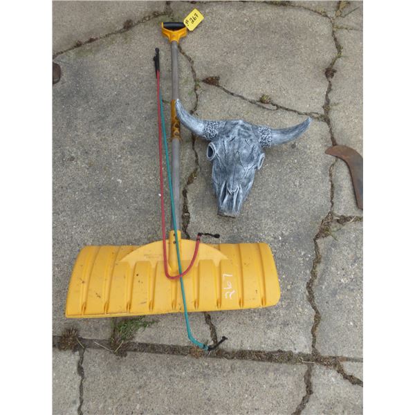 SHOVEL, WHIPS, AND GARDEN DÉCOR.-COW SKULL