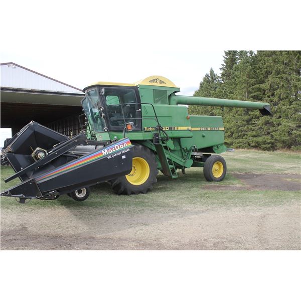 APPROX. 1984 JD 8820 TURBO COMBINE SELLS C/W PICKUP HEADER
