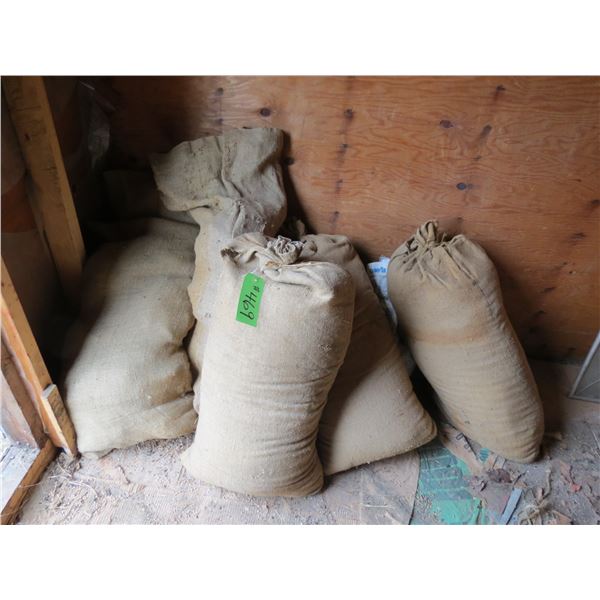 2- SACKS OF EMPTY BURLAP AND 4 BAGS OF BEDDING (SELLING BY THE PILE)