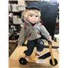 Porcelain Boy Doll on Wooden Scooter