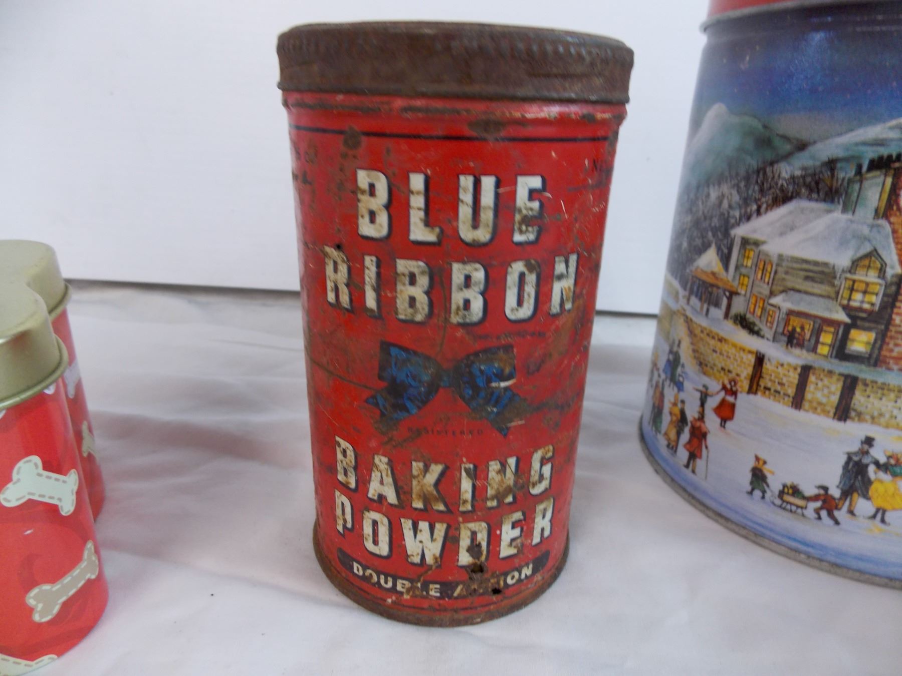 Blue Ribbon baking powder tin and other assorted tins