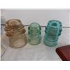 Image 2 : glass insulators with bottle capper and caulking gun