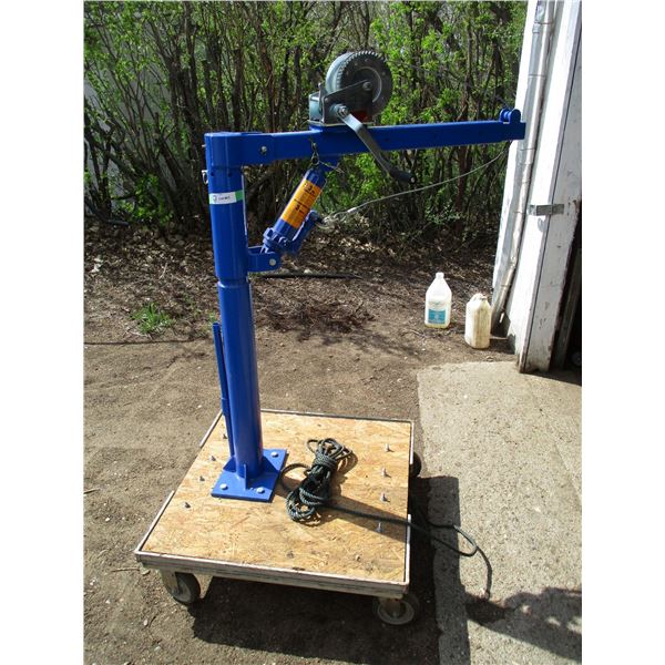 1000 pickup crane mounted on platform, with castors