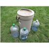 Image 1 : Garbage can with water jugs