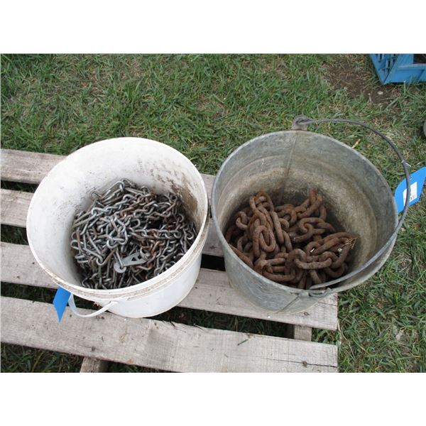 (2) pails of tire chains