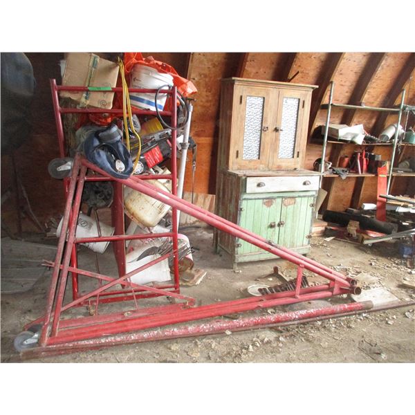 Storage rack stand on castors (with contents - hub caps, tarp, piping + misc) GREY PIPES NOT INCLUDE