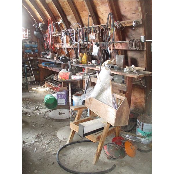 LOT - Work bench with wall contents - metal stand + (2) vises, wrenches, bolt bin, scrap iron, etc (