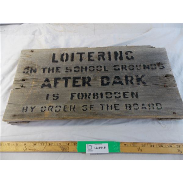 Loitering on the school grounds wooden sign
