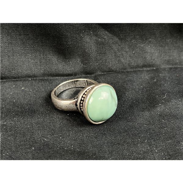 Large silver tone ring with blue center stone