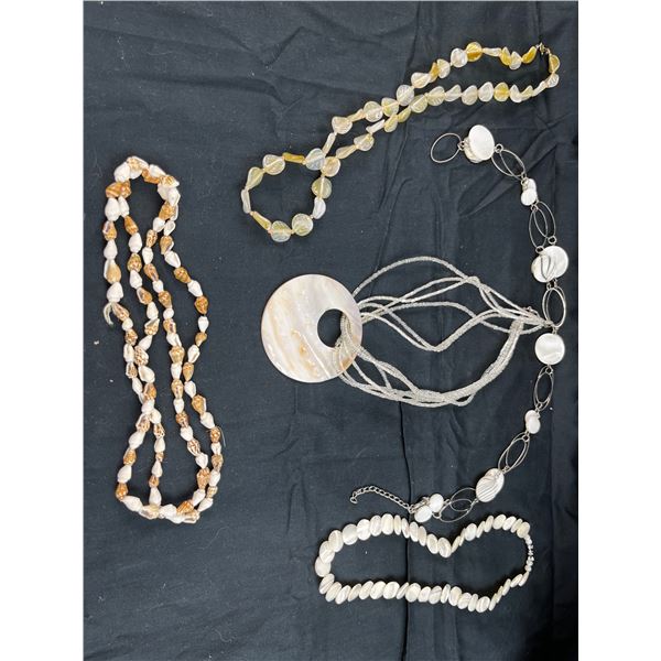 5 ocean style necklaces with shell/bead types