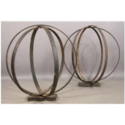 Two antique iron rings sculptural spheres