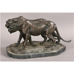 Pair of bronze cheetahs on marble base.