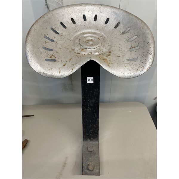 TIN IMPL SEAT ON STAND