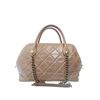 Image 1 : Chanel Quilted Castle Rock Brown Bowler Bag