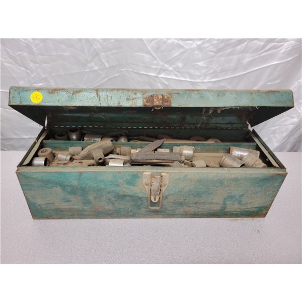 Old green metal tool box with assorted antique tools inside