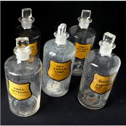 6 apothacary bottles, lable under glass