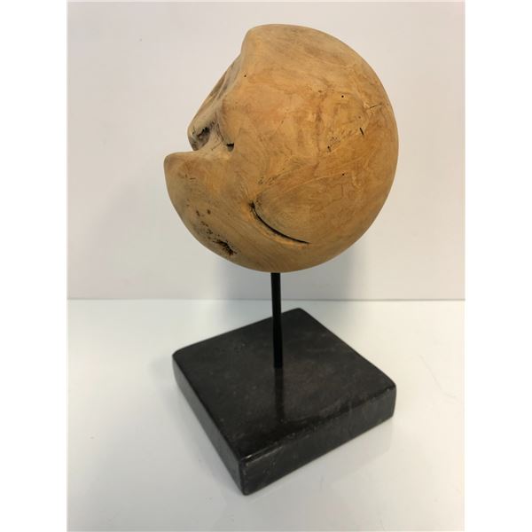 Round solid wooden orb sculpture on a marble base - approx. 7in diameter x 12in tall