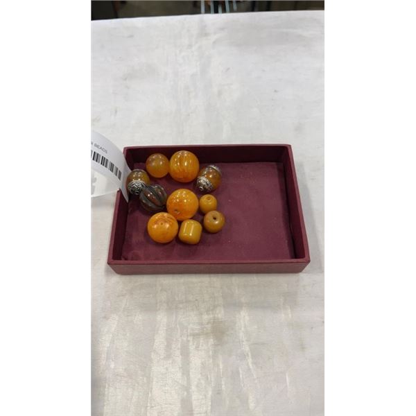 TRAY OF AMBER BEADS