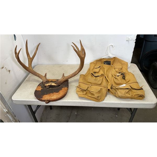 ANTLERS ON MOUNT AND FISHING VEST