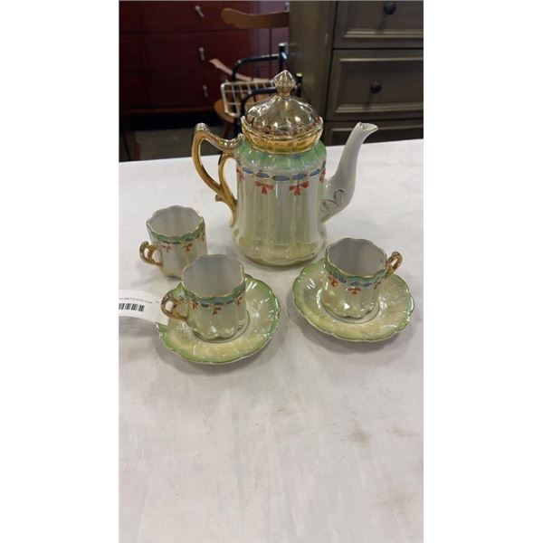 GERMAN TEAPOT WITH MATCHING CUP AND SAUCERS