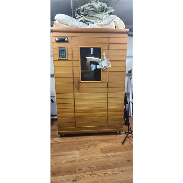 HEALTH MATE INFRARED SAUNA MODEL NUMER 012-0034C  HM-NSE-2-CD. COMES WITH BUILT IN RADIO. 74" X 49" 