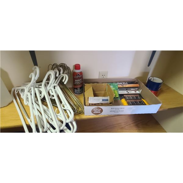 LARGE OT OF BATTERIES AND SSOME COAT HANGERS