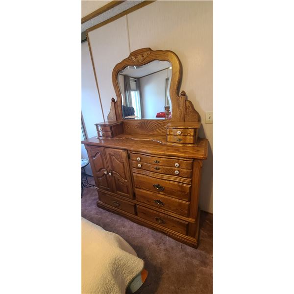 TWO MATCHING SOLID WOOD DOUBLE HIGHBOY DRESSERS ONE WITH JEWELRY DRAWS AND CLOTHING DRAWERS THE OTHE