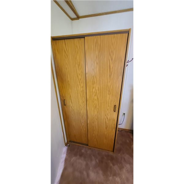 LARGE CUPBARD/CABINET WITH SLIDING DOORS, ONE SHELF AND CLOTHES RACK SIZE 3' X 2 X6'