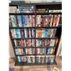Image 1 : 150+/- VHS AND DVDS - COMES WITH SHELVING UNIT. PLEASE SEE IMAGES FOR MORE INFO