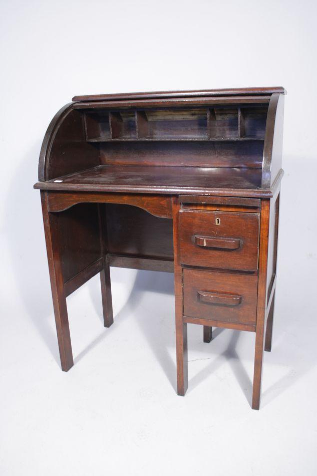 A Vintage Child's Roll Top Desk and Chair.