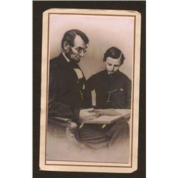 Abraham Lincoln photo with young man leafing through a book