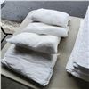 Image 2 : TOTE OF SPILL ABORBANT MATERIALS: 9 TUBE SOCKS, 50 SHEETS AND 4 PILLOWS