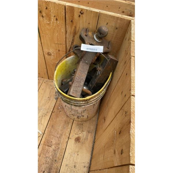 BUCKET OF TARILER HITCHES AND MANY BALLS