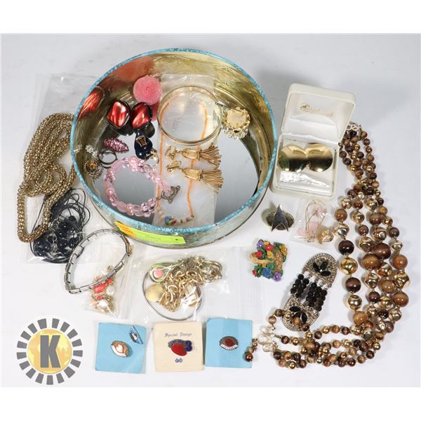 ROUND TIN FULL OF ASSORTED WOMENS JEWELRY