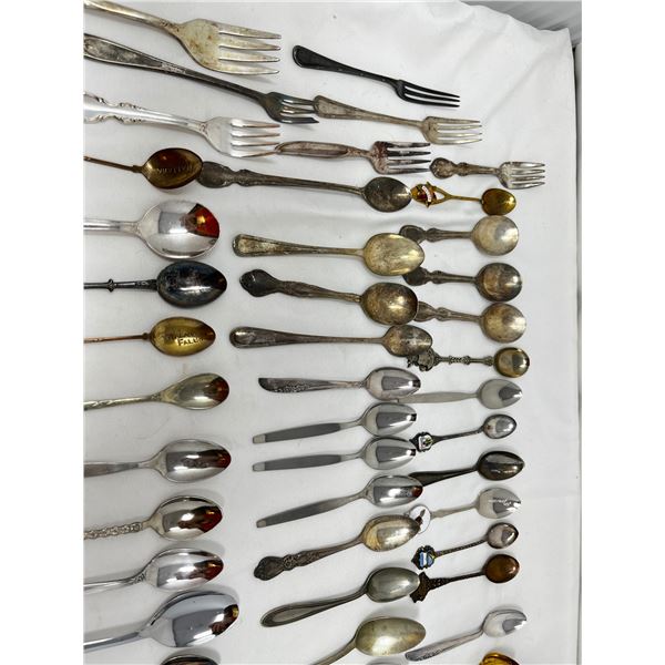 Mixed souvenir spoons and mixed cutlery