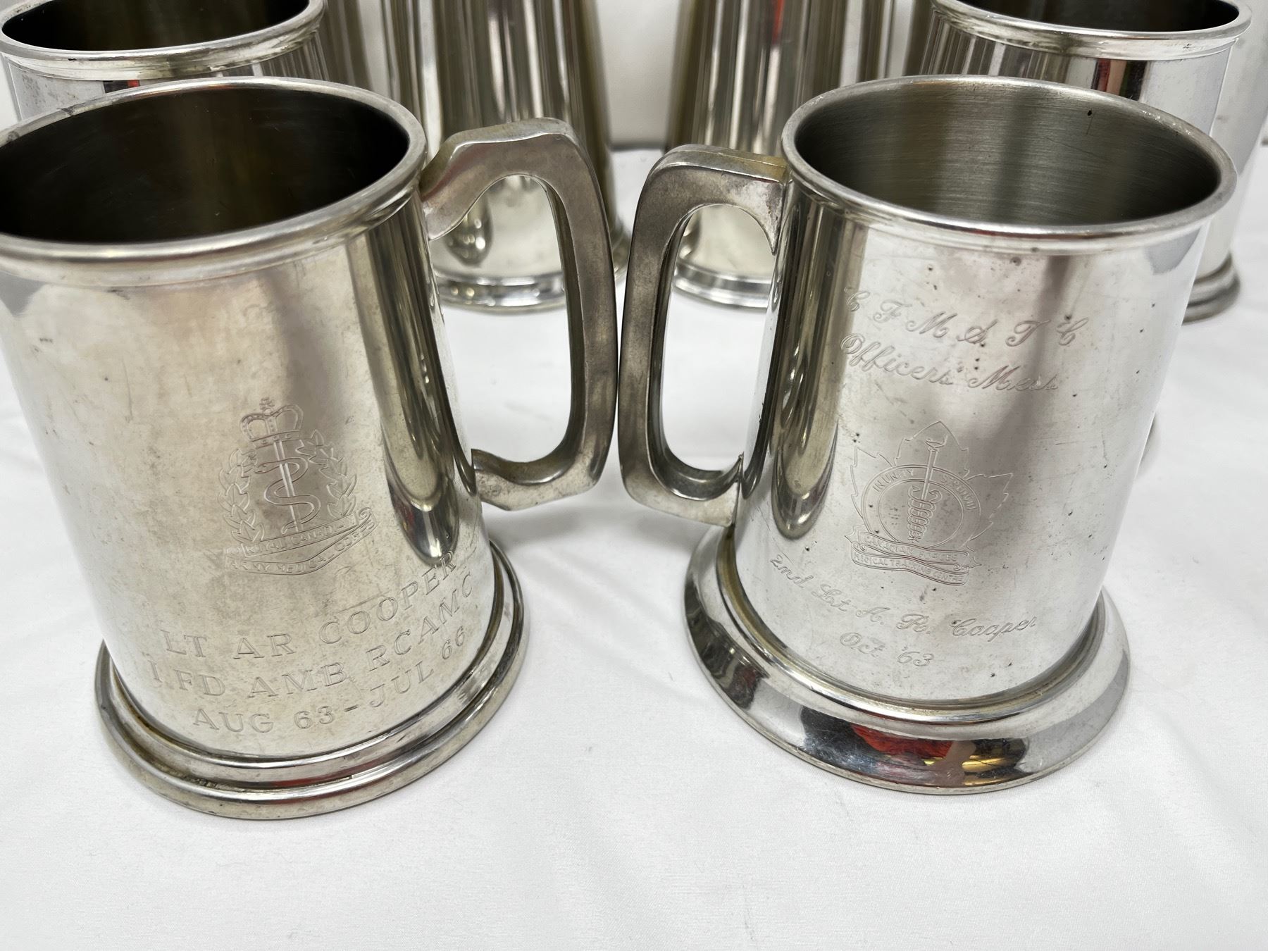 8 mixed pewter glass bottom beer mugs
