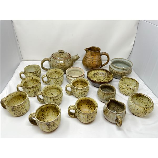 8 piece earthen ware tea set with various bowls