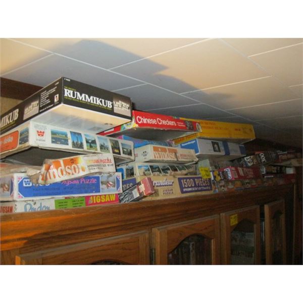 ASST. GAMES & PUZZLES ON TOP OF CHINA CABINET