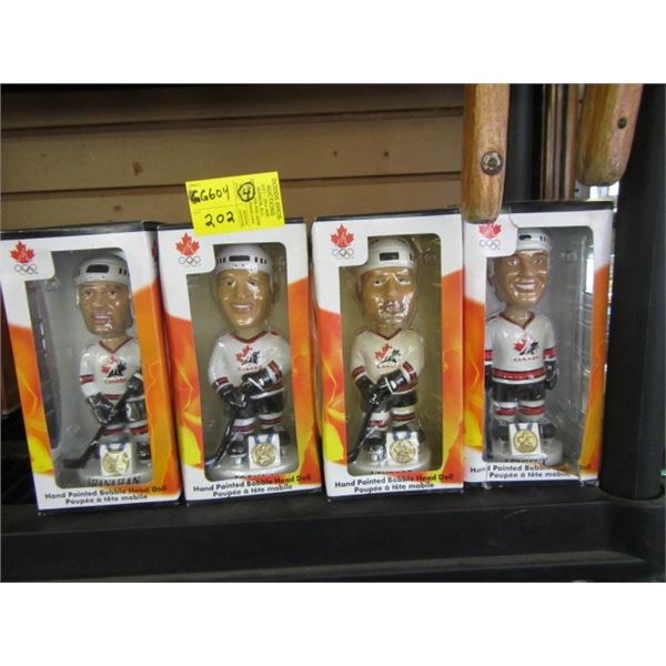 FOUR HAND PAINTED BOBBLE HEAD HOCKEY FIGURINES