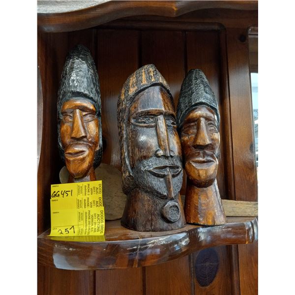 THREE CARVED WOODEN HEADS AND SPOON