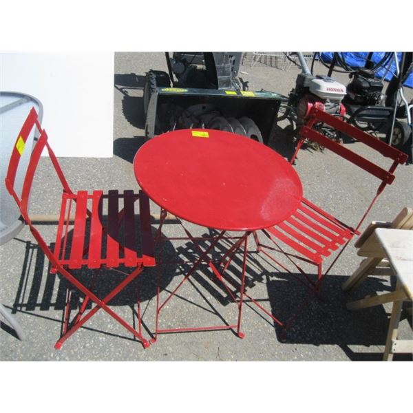 RED METAL FOLDING ROUND BISTRO TABLE AND TWO FOLDING CHAIRS